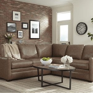 Brown, leather, 5 cushion sectional with classic track squared arm rests.