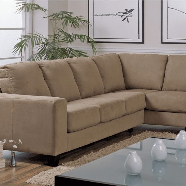 Beige, upholstered, 6 cushion sectional with squared off arm rests.