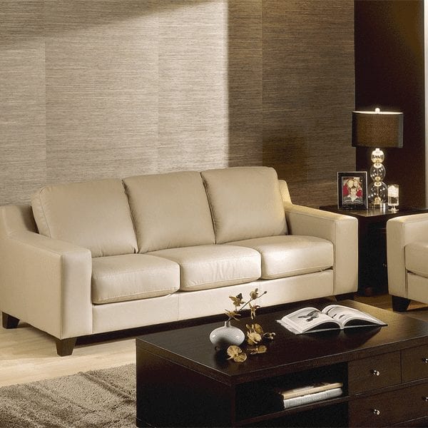 Beige, leather, 3 cushion sofa with squared arm rests.