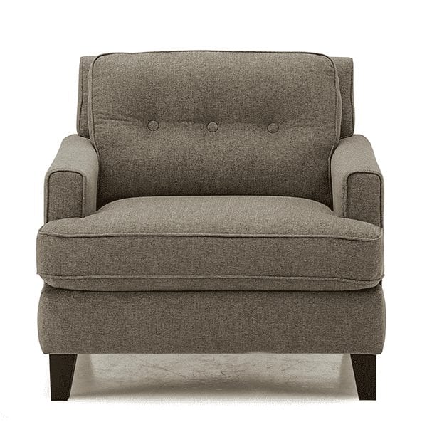Grey, upholstered, tufted back armchair with low track, squared off arm rests.
