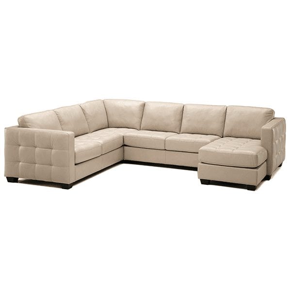 Beige, leather, 6 cushion tufted seat sectional with tufting detail on sides and chaise on right side.