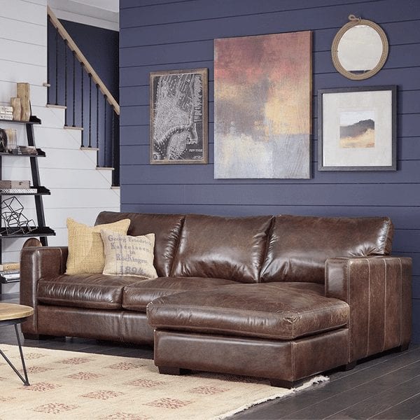 Brown, leather, 3 cushion sofa with classic track, squared arm rests and chaise on right side.